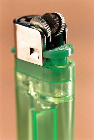 Malfunctioning Green Used Lighter closeup