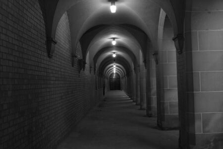 Dark dungeon walkway with lightsの写真素材