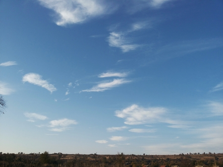 Magnificent landscape of flat terrain. The beauty of the wilderness. Endless meadows. walk in the fresh air. Clean nature on a blue sky background.の写真素材