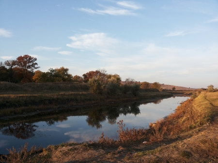 Magnificent landscape of flat terrain. The beauty of the wilderness. Endless meadows. walk in the fresh air. Clean nature on a blue sky background.の写真素材