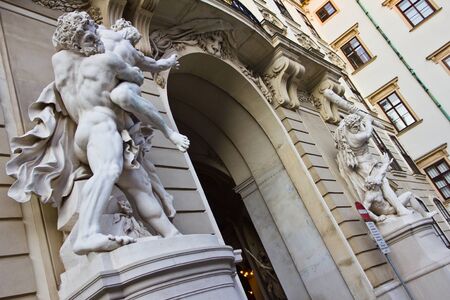 Hercules white stone statues in the southern entrance of Hofburg palace in Vienna, Austria. Part of the series known as "The Labors of Hercules" by Lorenzo Matielli.のeditorial素材