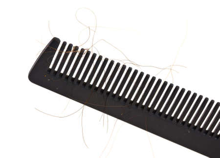 Comb full of hair, concept for hair loss, isolated on white.の写真素材