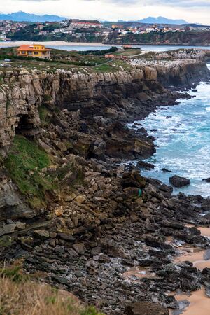 Muengo and its cliffs in the beach of Los Caballos, Cantabria (Spain).の写真素材