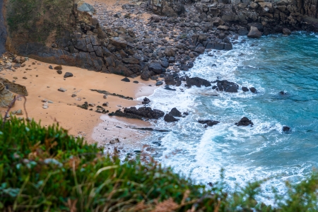 Beach of sand and rocks in the coast.の写真素材