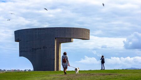 Eulogy of the Horizon, with people (unrecognizable) walking around, in Gijon, Asturias.の写真素材