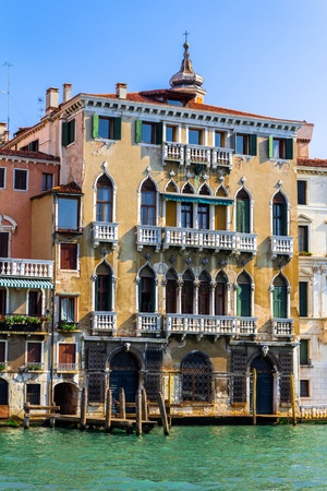 Typical yellow venezian building beside the grand canal.の写真素材