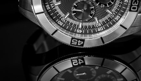 Luxury Watch over reflective surface  Selective focus, shallow depth of field 