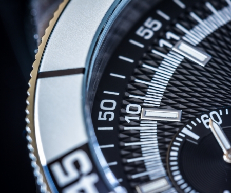 Close up of a steel chronograph. Selective focus, shallow depth of field.の写真素材