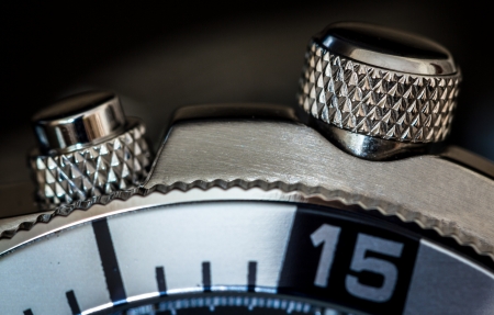 Detail of a chonograph buttons. Selective focus, shallow depth of field.の写真素材