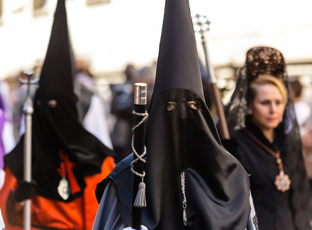 VALLADOLID, SPAIN  APRIL 17, 2014  Beautiful eyed girl with a nazareno mask in the religious processions during Holy Week on Good Thursday, on April 17, 2014 in Valladolid, Spain のeditorial素材