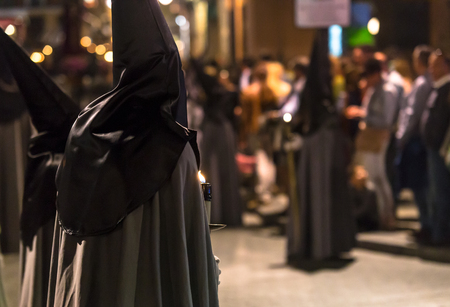 VALLADOLID, SPAIN – APRIL 17, 2014  Nazarenos with candles in the religious processions during...