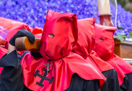 Group of Nazarenos carrying a statue during the Good Thursday during Holy Week in Valladolid.の写真素材