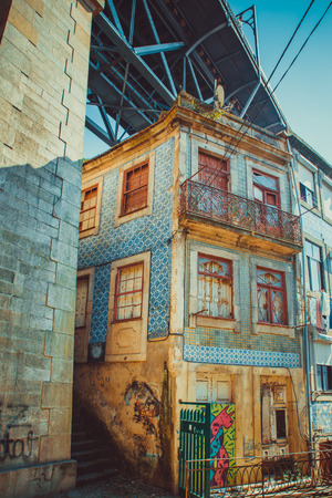 Decaying building in Porto under a bridge.の写真素材