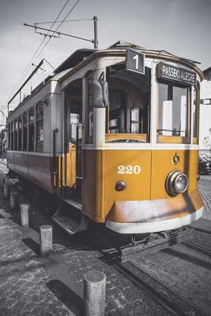 Desaturated picture of the Porto trolley except for its particular yellow.のeditorial素材