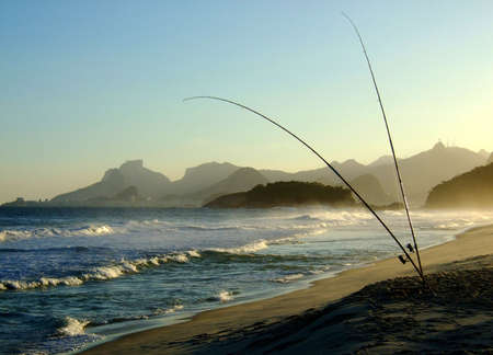 Fishing in Piratininga beach, in the late afternoon, with the Corcovado view from Rio de Janeiro in the backgroundの写真素材