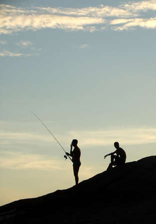 Fishing on the sunset at the beach in NiterÃÂ³i, Rio de Janeiro, Brazilの写真素材