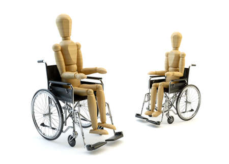 Wheelchair with wooden man sitting isolated on white backgroundの写真素材