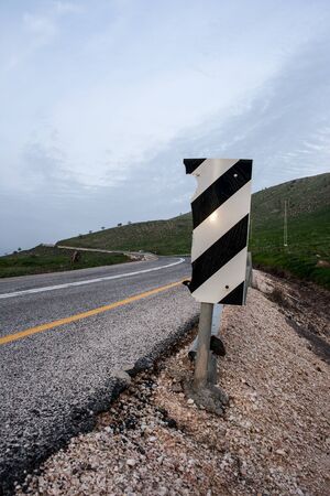 A sign beside the roadの写真素材