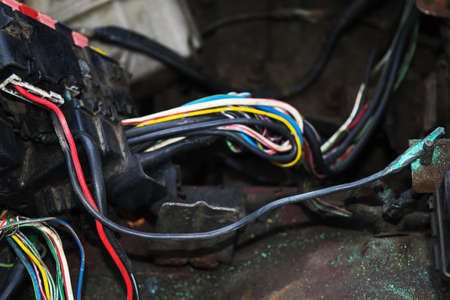 Oxidized damaged ignition wire in the car. The ignition switch wire is broken. Broken wire. Broken...