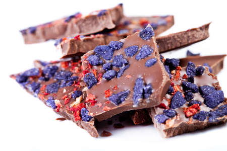 Chocolate with strawberries and flowers violets