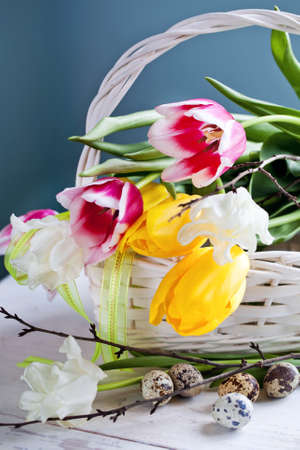 Tulip flowers in white basket