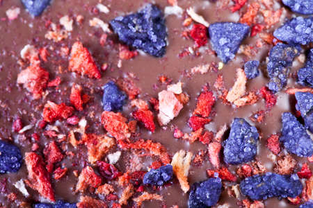 Chocolate with strawberries and flowers violetsの写真素材