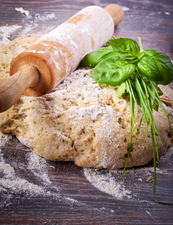 Bread dough with italian herbsの写真素材
