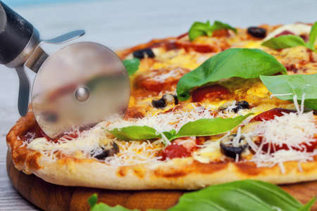 Delicious fresh pizza served on wooden tableの写真素材