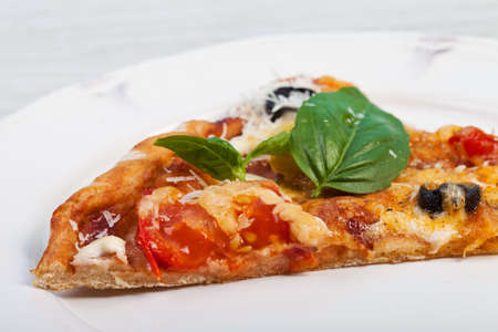 Delicious fresh pizza served on wooden tableの写真素材