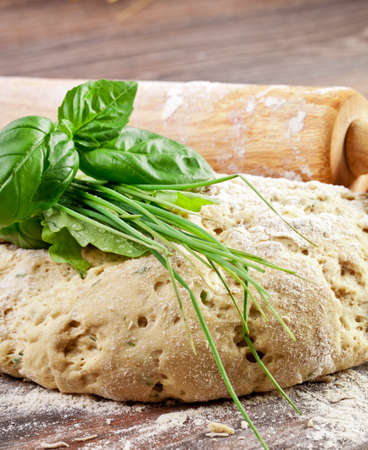 Bread dough with italian herbsの写真素材