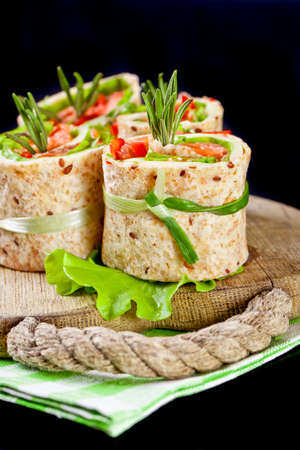 Salmon lavash rolls with fresh salad leafsの写真素材