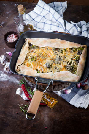 Tarte pie with broccoli, cheese and fresh onionの写真素材