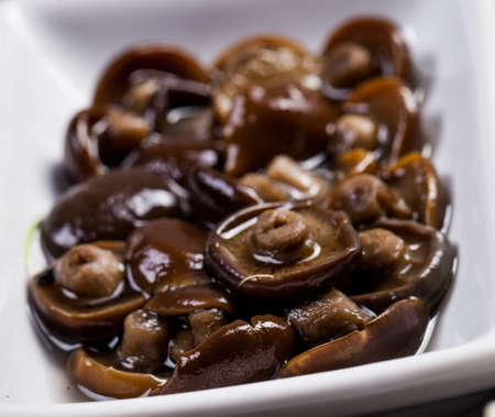 Ingredients for sushi on black plate in dark wooden backgroundの写真素材