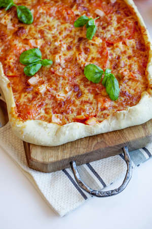 Pizza on wooden tableの写真素材