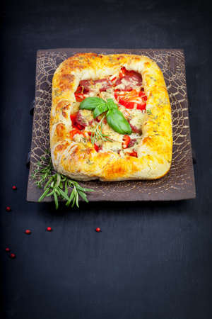 Pizza with dry cured ham and arugulaの写真素材