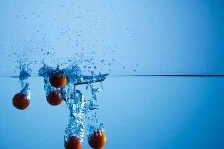 Cherries in waterの写真素材