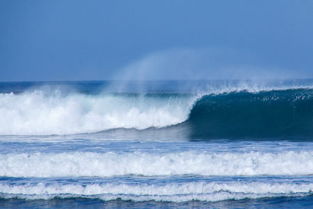 Wave breaking with foam on topの写真素材
