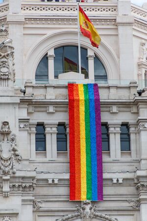 Huge rainbow flag in building of the city hall of Madridの写真素材