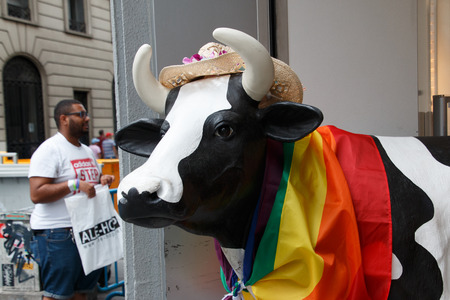 June, 30 2017. Madrid, Spain. Plastic cow decorated with the gay pride flagのeditorial素材