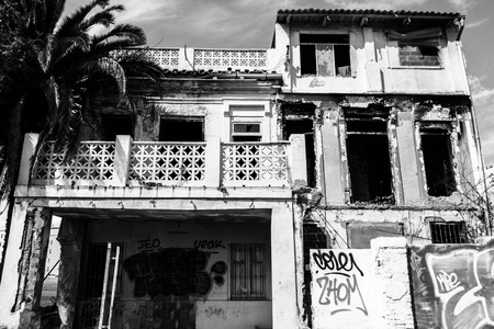 Facade of an abandoned house with graffitiのeditorial素材