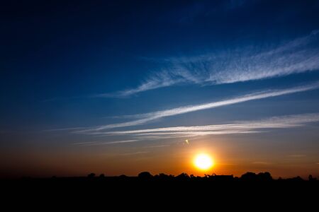 Sunset with silhouettesの写真素材