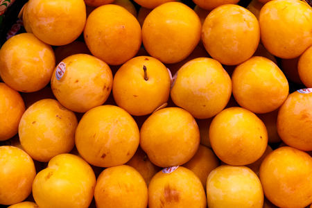 yellow plums in a market in Madridの写真素材