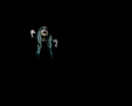 portrait of blonde girl in the dark