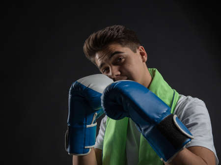 Young boxer isolated on a black backgroundの写真素材