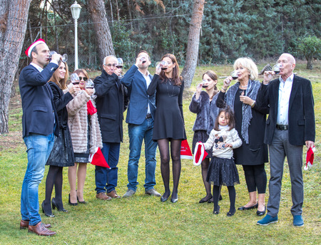 Family of many members, celebrating a party in the garden of their homeの写真素材