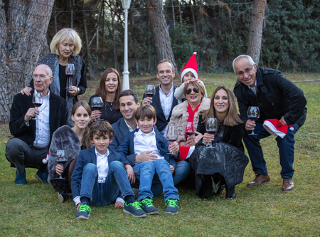 Family of many members, celebrating a party in the garden of their homeの写真素材