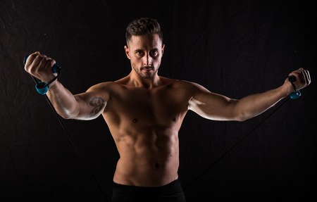 T-shirt free caucasian brown boy fitness and posing in a photographic studio