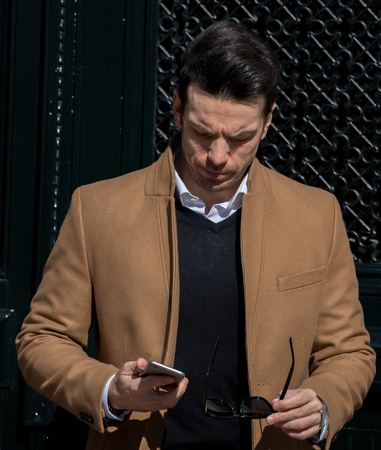 Session with elegant life style clothes with male model in the streets of madridの写真素材