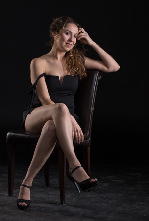 Studio photo shoot for a blonde girl with wavy hairの写真素材
