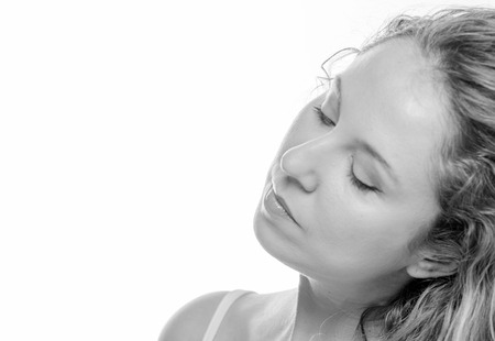 Studio photo shoot for a blonde girl with wavy hairの写真素材